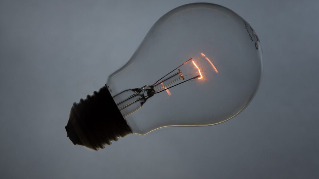 A smart bulb not connecting to wifi, seen as a single bulb against a grey background